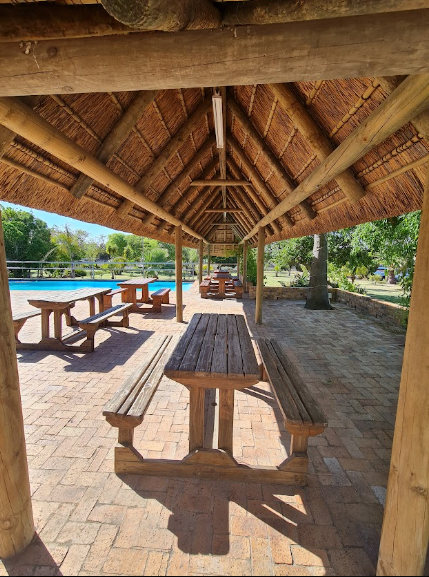 Under the thatch lapa looking out over the pool